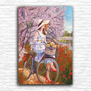 Devojka na bajsu i cvetno drvo